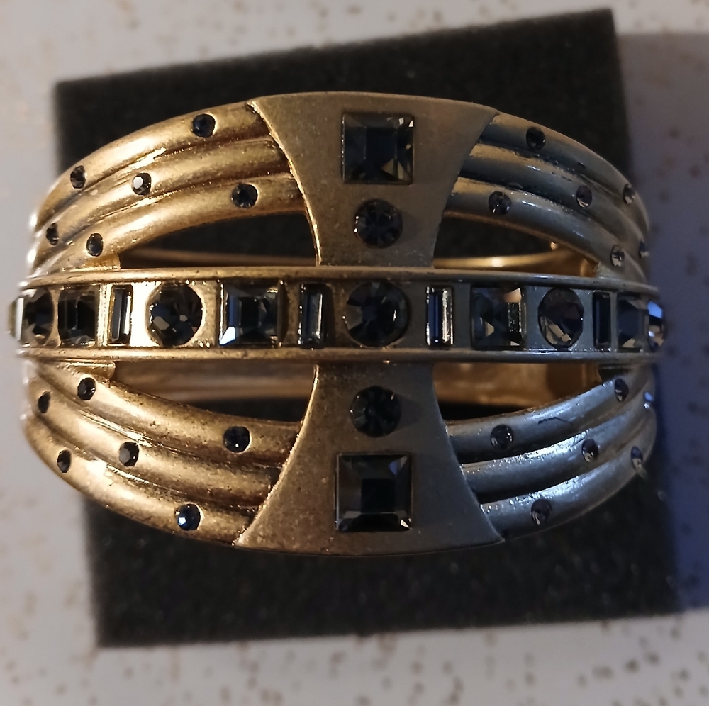 Lia Sophia Graduated Gold Tone crystals hinged bracelet.